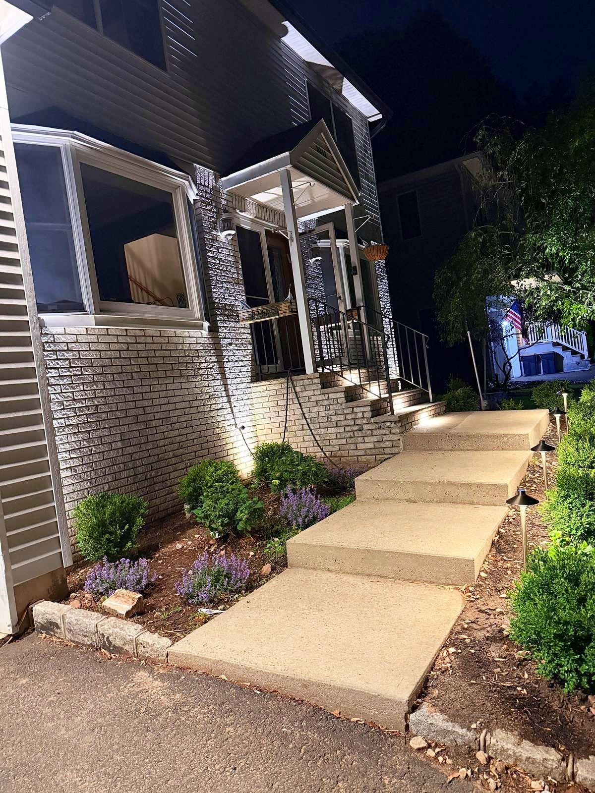Front steps and entry lit with path lights