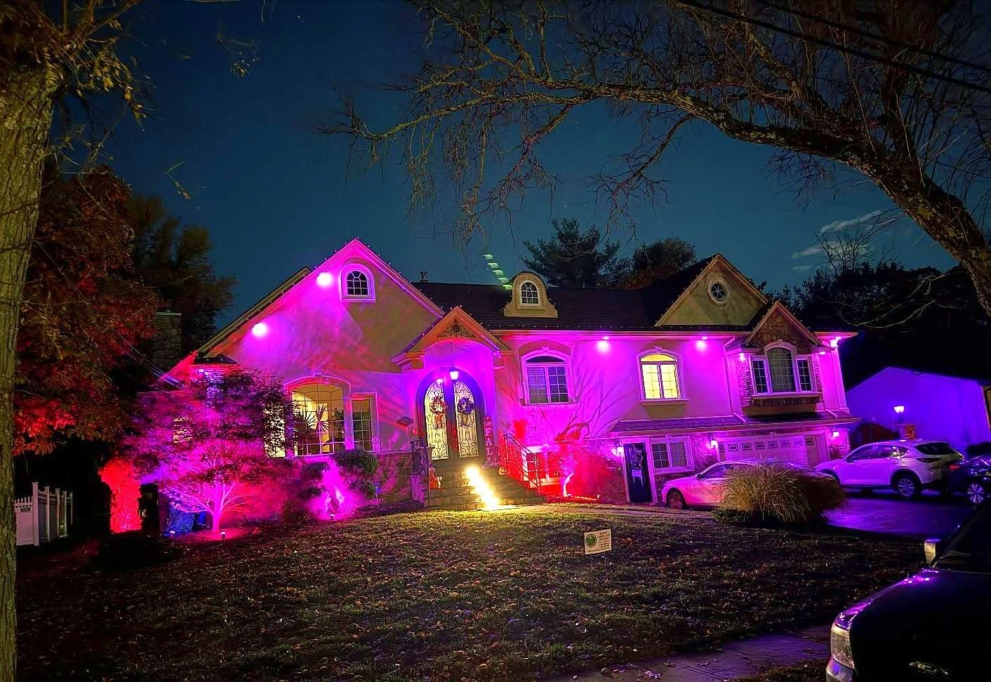 Stucco colonial washed in purple light