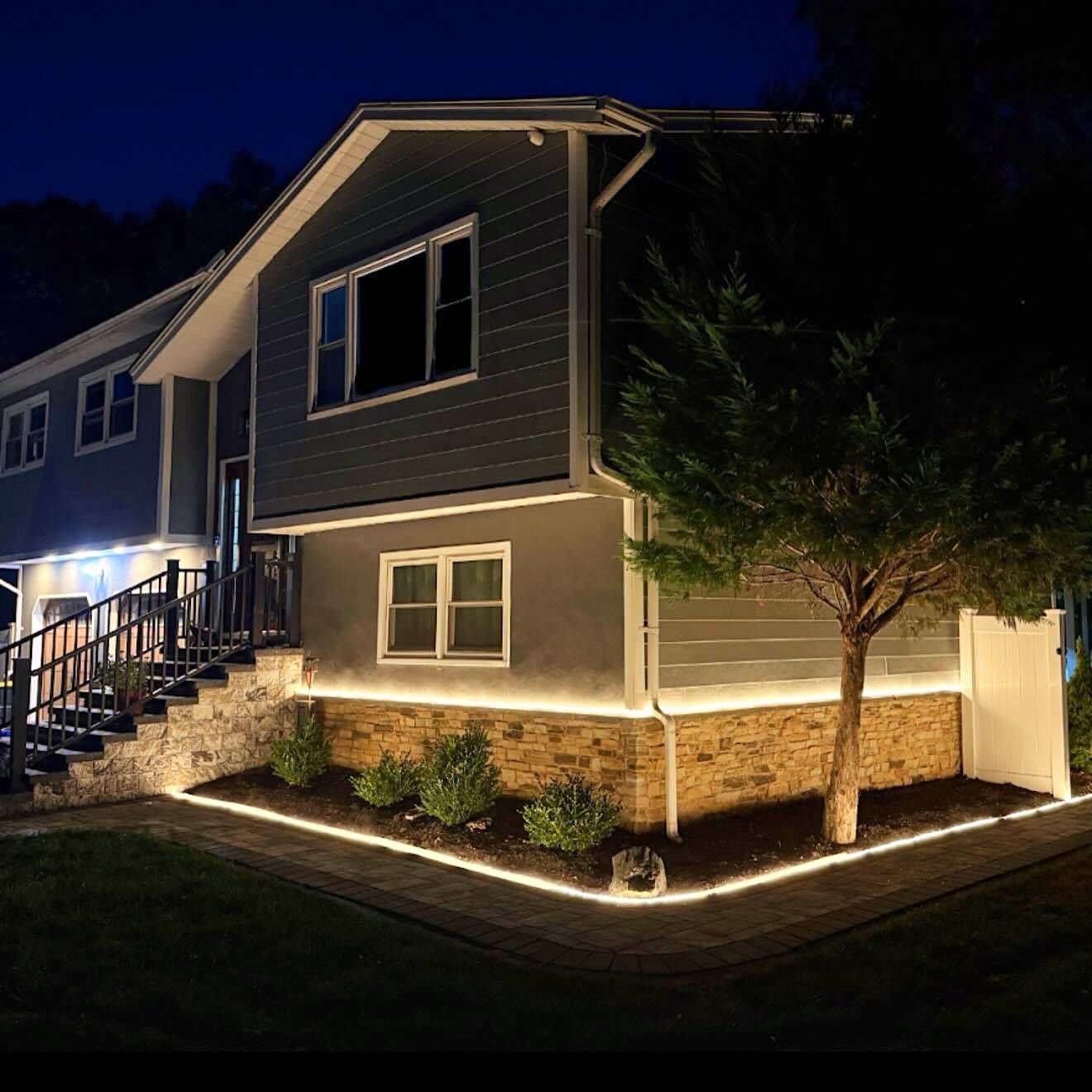 Split level with a light strip under the stone ledge